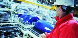 Power Generation man overlooking plant interior pic